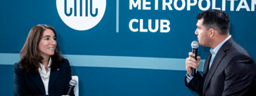 Beth Hammack standing at a podium.