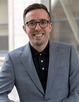 Headshot of Brett Huettner