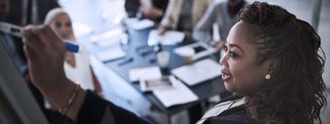 A sample image of a woman in a meeting related to data brief publications